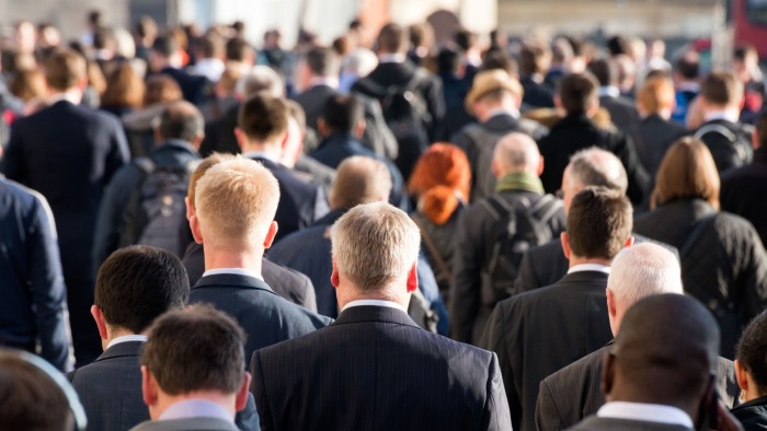 Commuters crossing crowded London Bridge