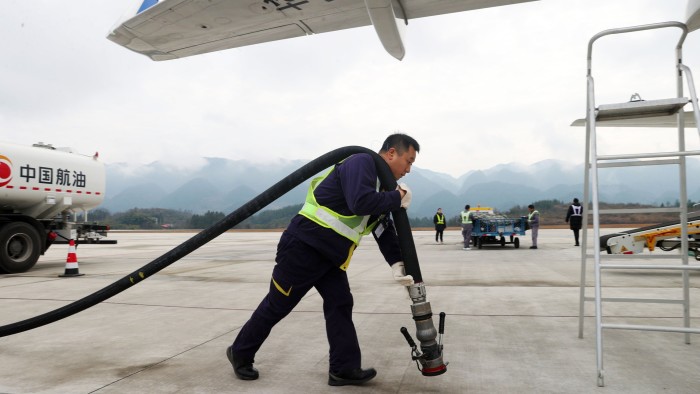 Man with aviation fuel pump