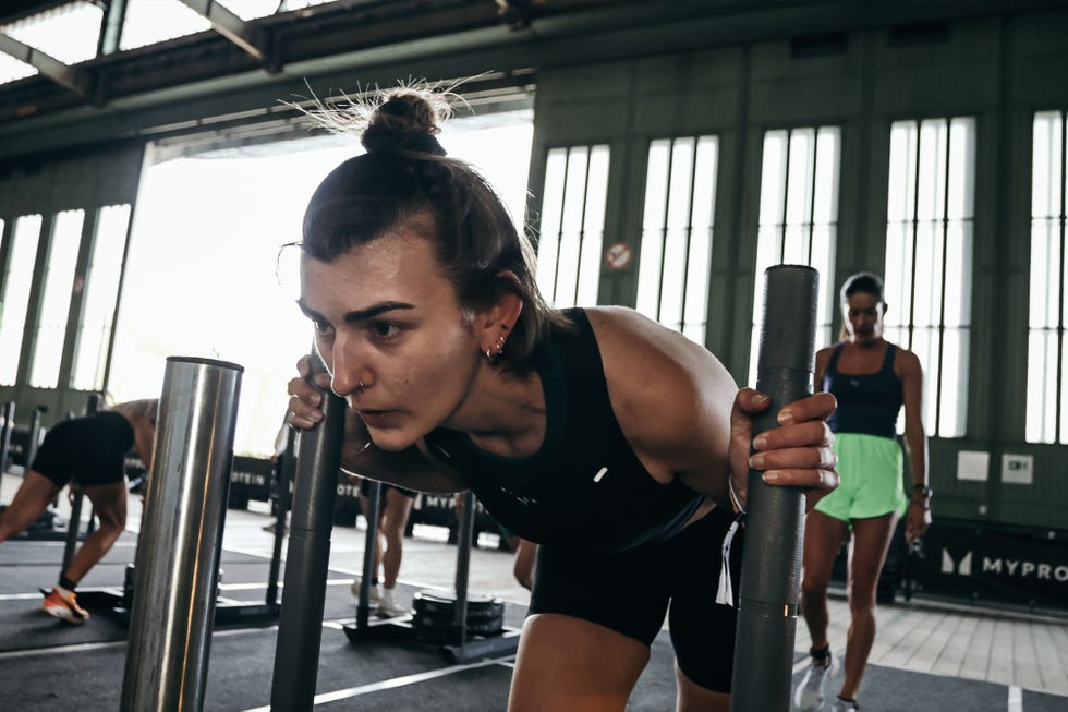 group workout session featuring individuals engaging in strength training exercises