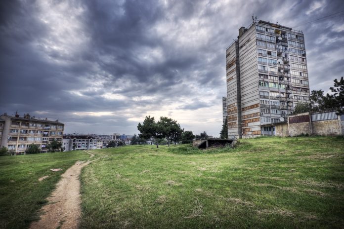 Run-down appartment building in southeast Europe set before a moody evening sky. High dynamic range photo. Please see my related collections... [url=search/lightbox/7431206][img]http://i161.photobucket.com/albums/t218/dave9296/Lightbox_Vetta.jpg[/img][/url]