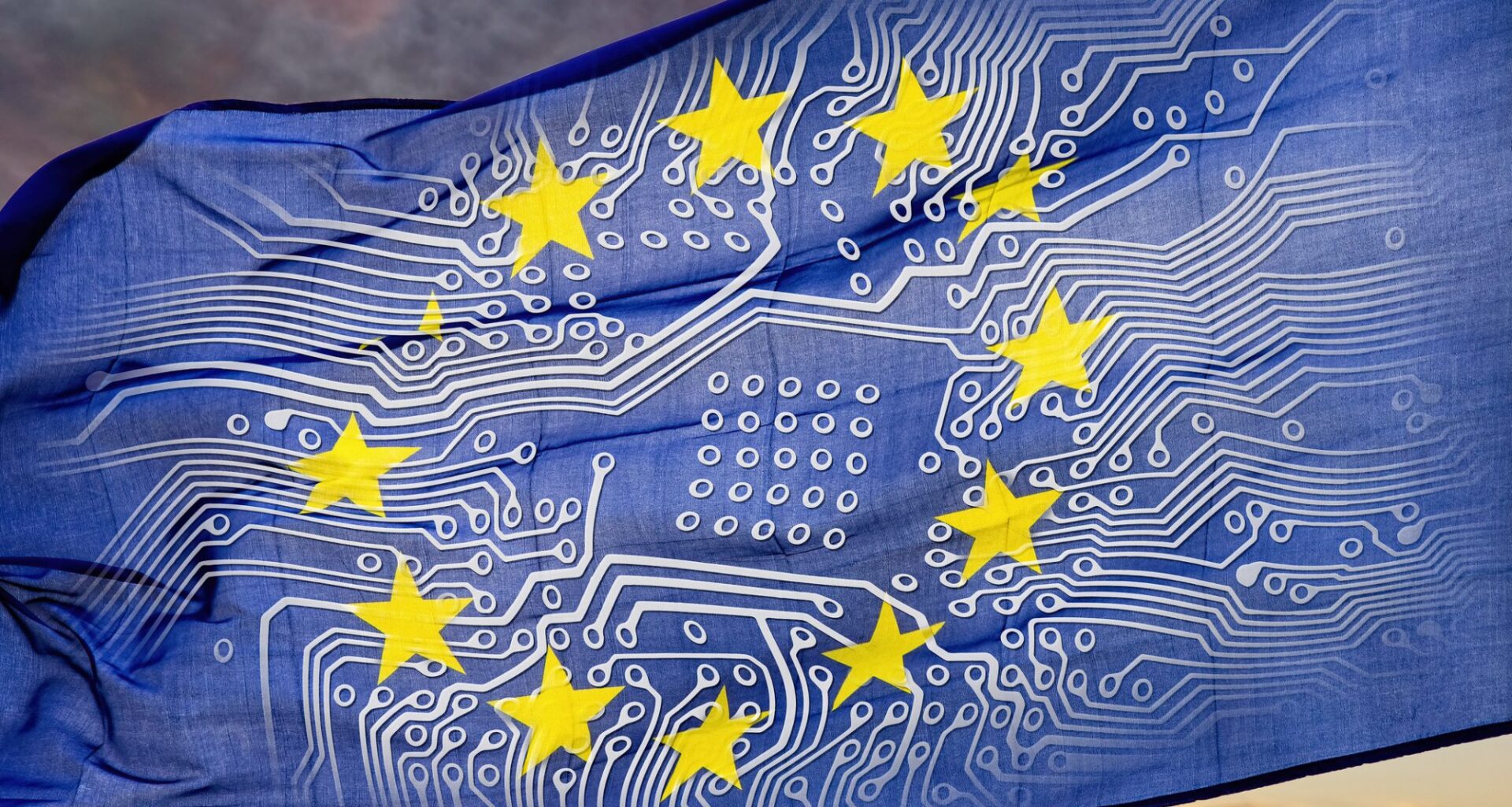 European flag with board in front of dramatic sky