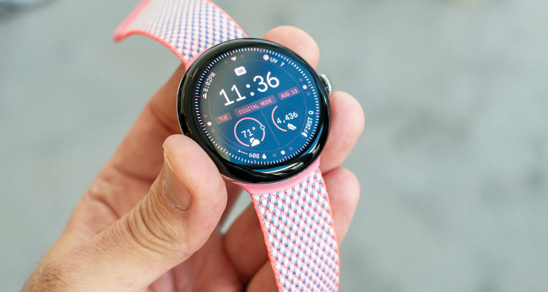 The Google Pixel Watch 3 in a user's hand showing the screen