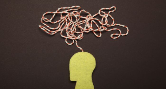 Image of a cutout person with a string coming out of its head