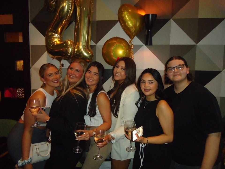 Group of young women celebrating a 21st birthday.