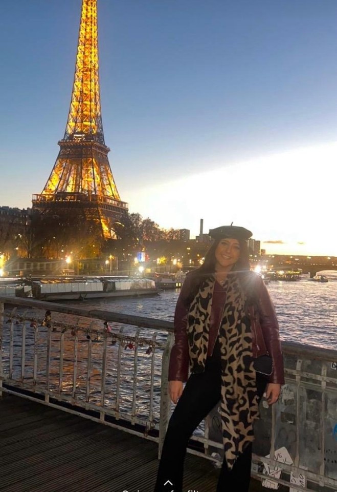 Woman in Paris with Eiffel Tower in background.
