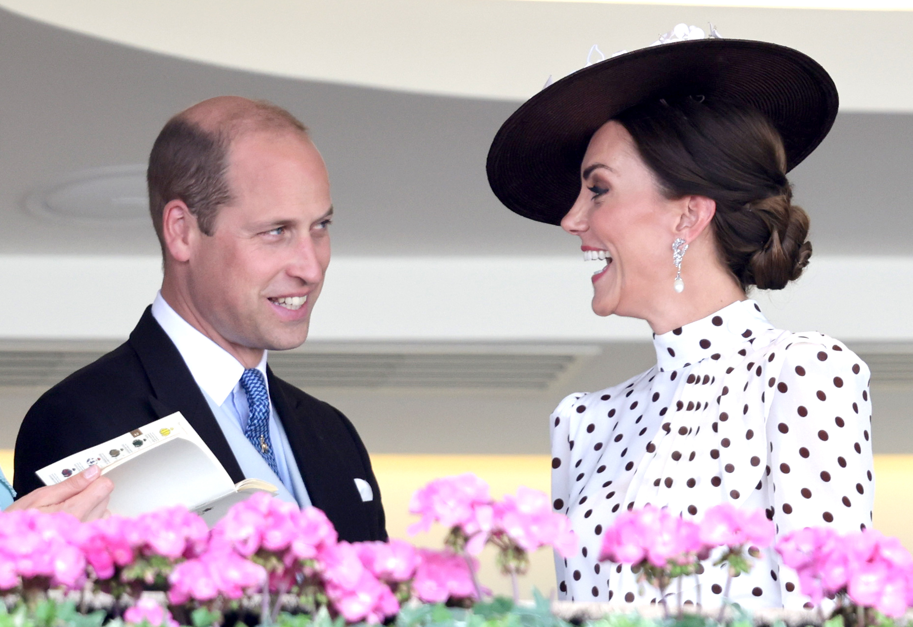 Prince William and Kate Middleton, wearing a black and white polka dot dress, at Ascot Racecourse on June 17, 2022