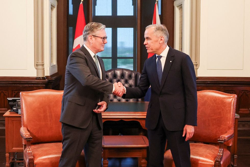 Keir Starmer and Mark Carney shake hands ahead of the G7 summit