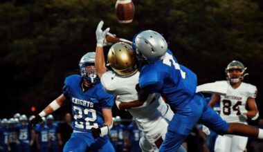 football players tackling