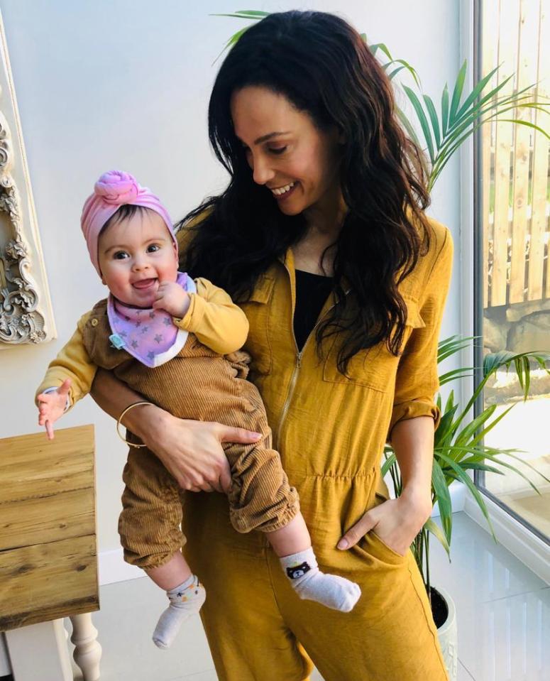 Woman holding her baby girl.