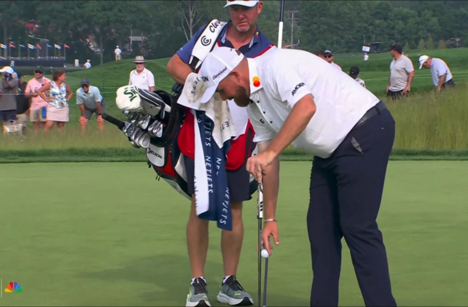 Lowry's caddie Darren Reynolds couldn't hide his confusion as his player picked up the ball without marking it