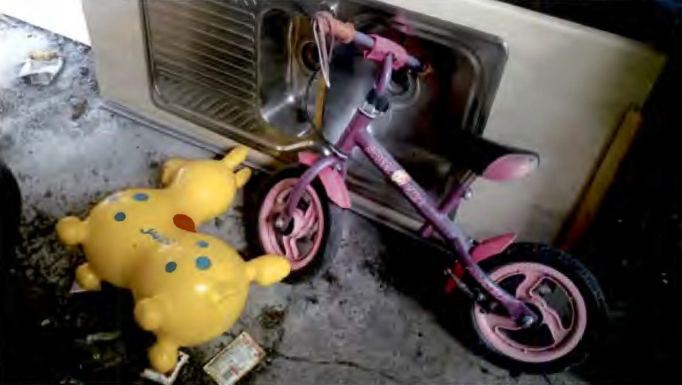 Children's bicycle and inflatable toy found at a crime scene.