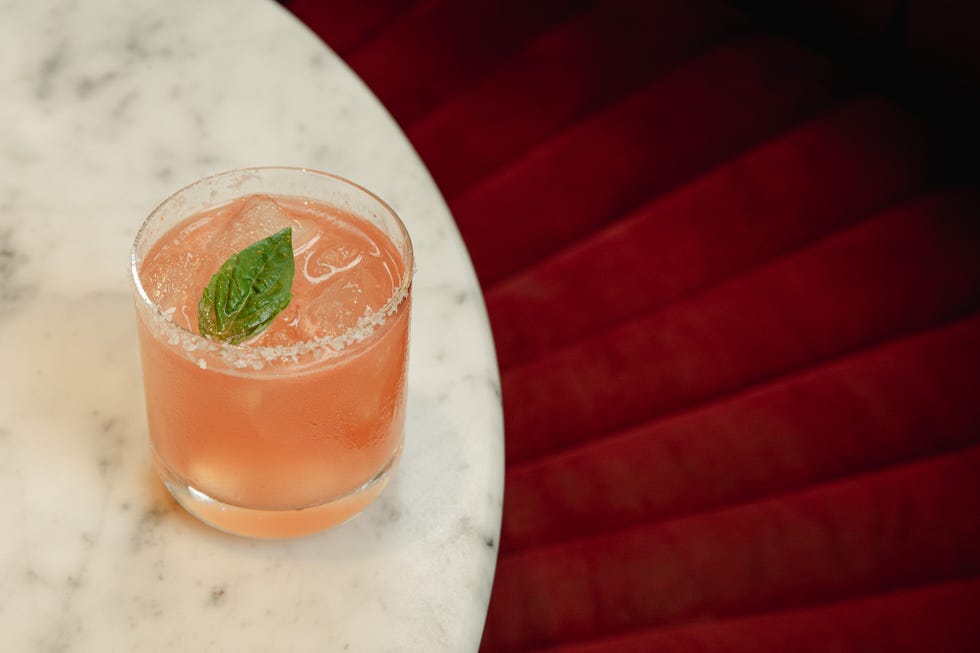a pink drink on a marble table