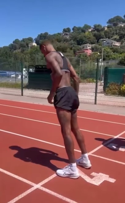 Marcus Rashford training on a running track.