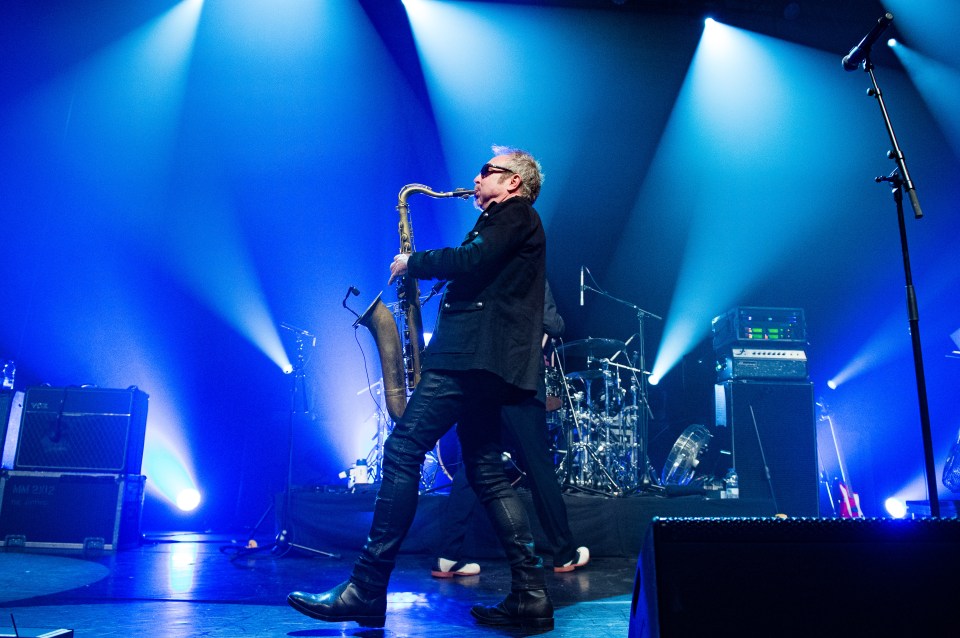 Mars Williams of The Psychedelic Furs performing on stage.