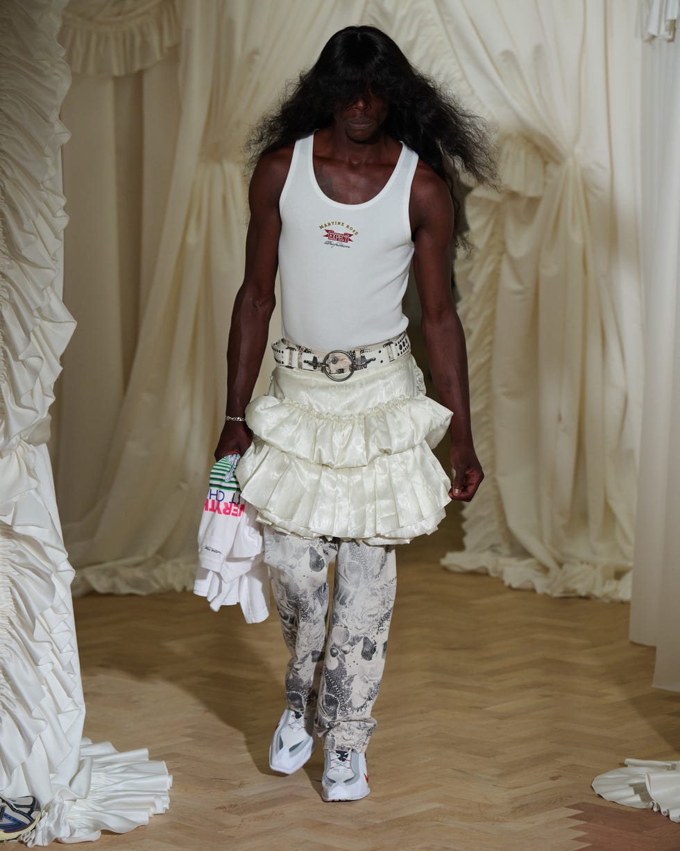 fashion model showcasing a unique outfit during a runway event