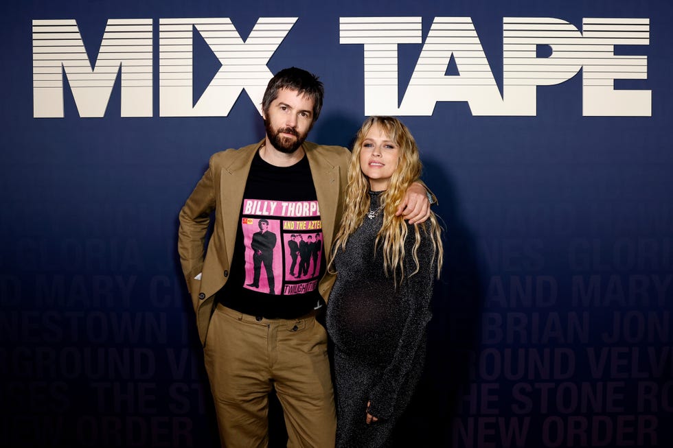 jim sturgess and teresa palmer posing together at the mix tape premiere