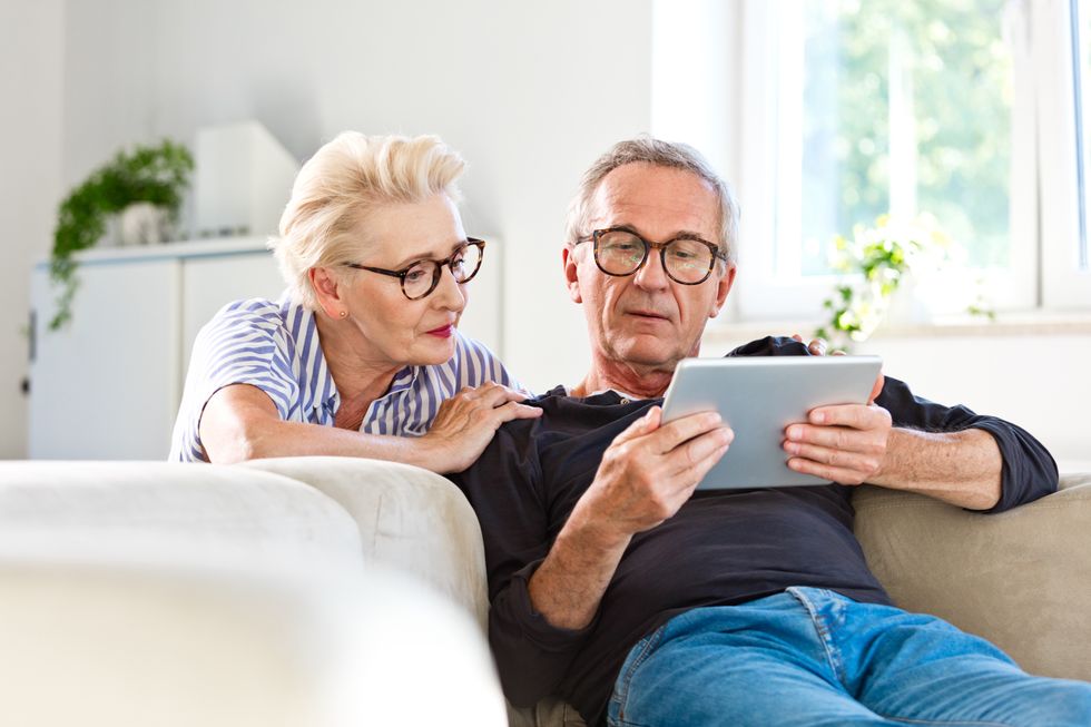 Older couple looking at tablet