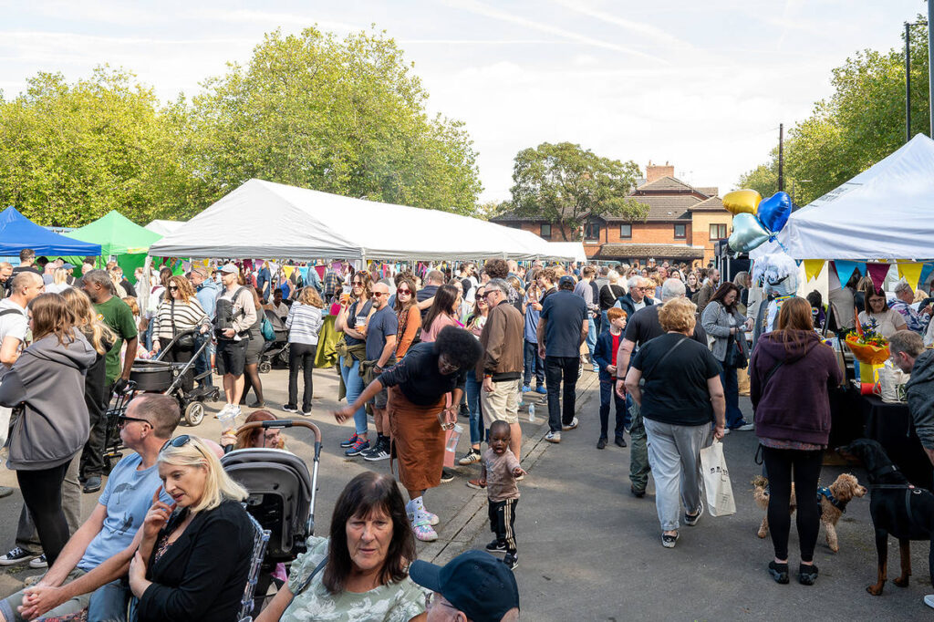 people wandering around stalls in urmston at food and drink festival