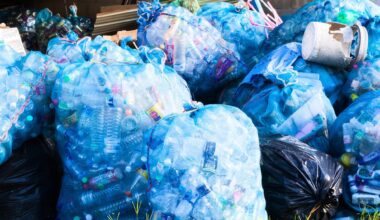 Plastic Bottles Waste In Big Plastic Bags At Recycle Center