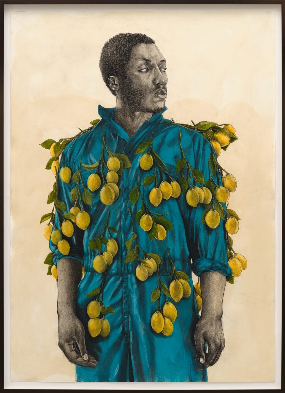 a portrait of a black man in a blue shirt with lemons growing from it