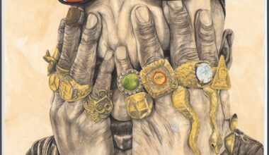 a man holds his hands over his eyes and each finger has a big gold ring with gems