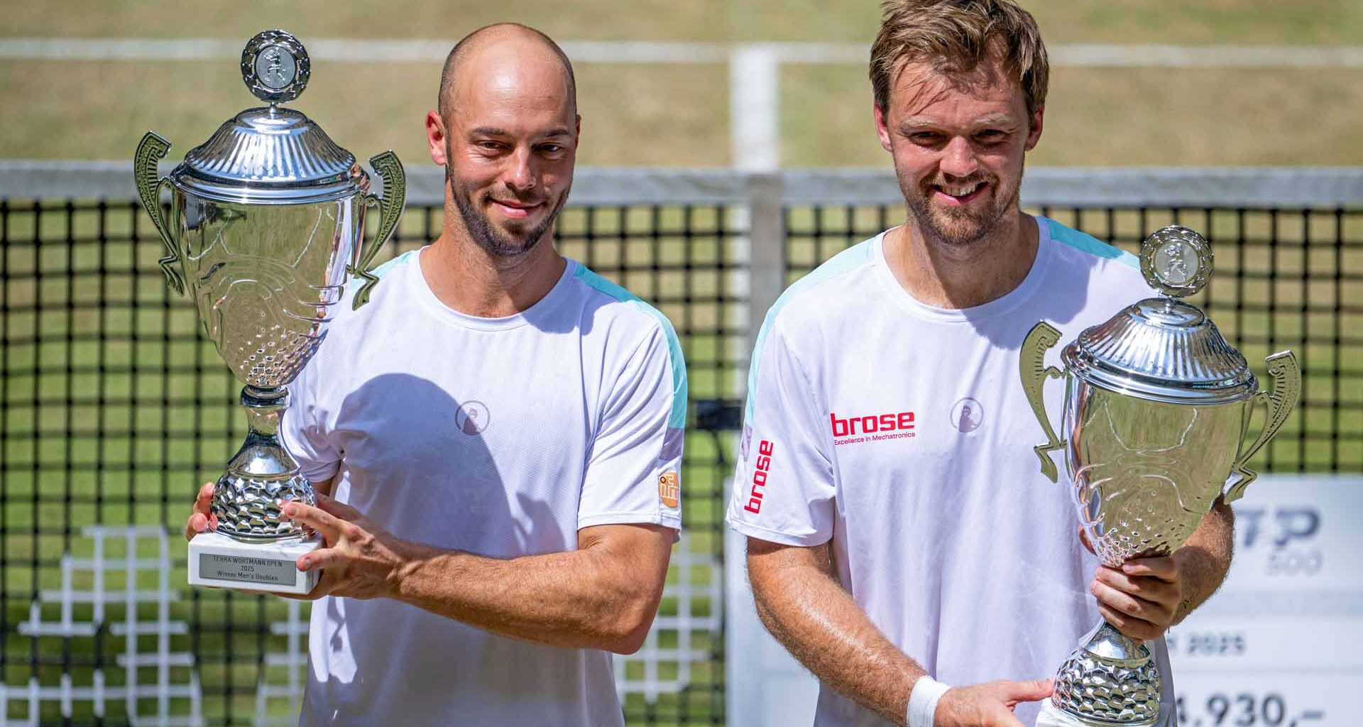 Tim Puetz and Kevin Krawietz celebrate their Halle victory. The Germans have won three titles together on home soil.