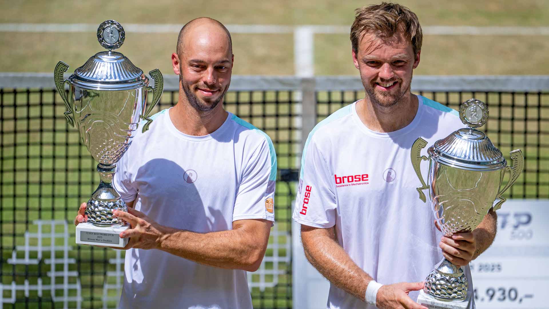 Tim Puetz and Kevin Krawietz celebrate their Halle victory. The Germans have won three titles together on home soil.