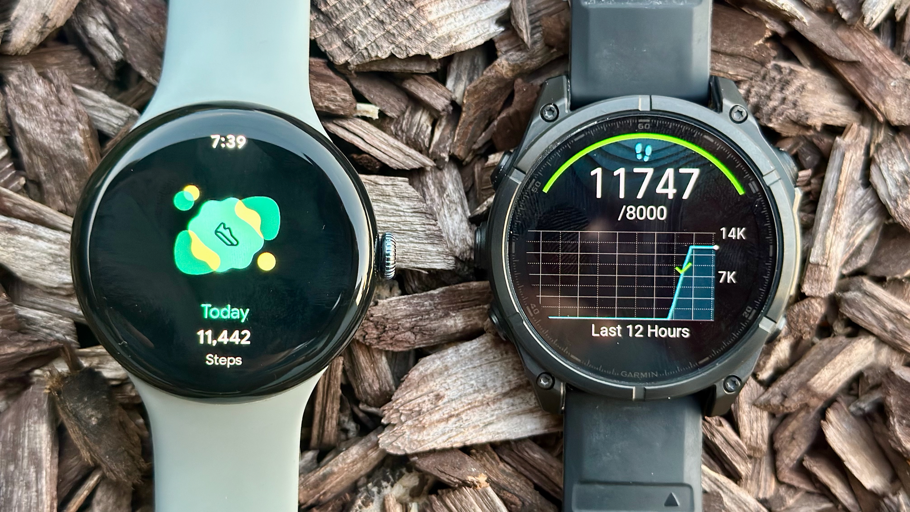 The Google Pixel Watch 3 (left) and Garmin Fenix 8 (right), both showing their respective step counts of 11,442 and 11,747.