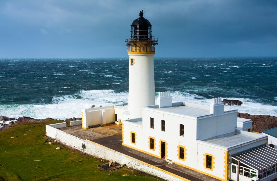 Rubha Reidh Lighthouse on a stormy coast.