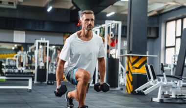 Man performing a dumbbell split squat