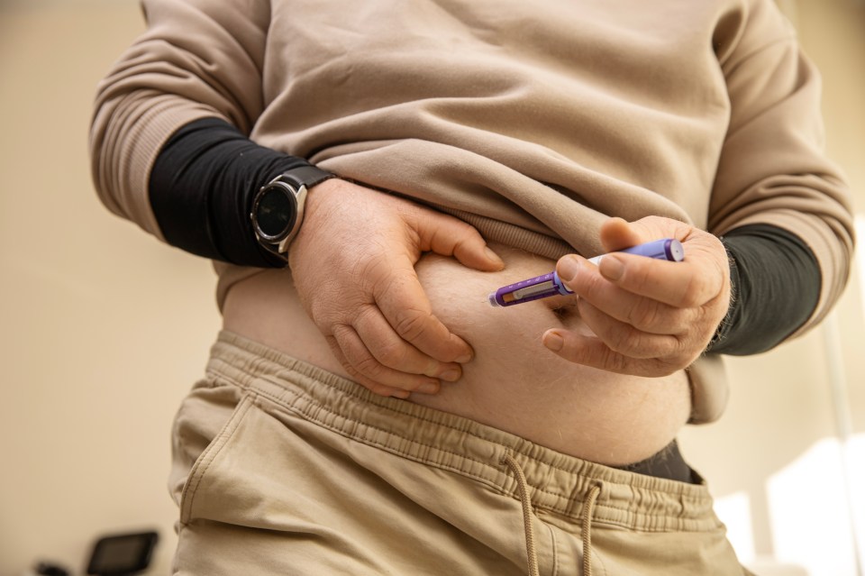 A person injecting semaglutide into their abdomen.