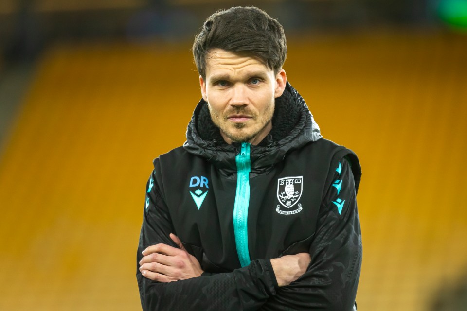 Danny Rohl, Sheffield Wednesday manager, with arms crossed.