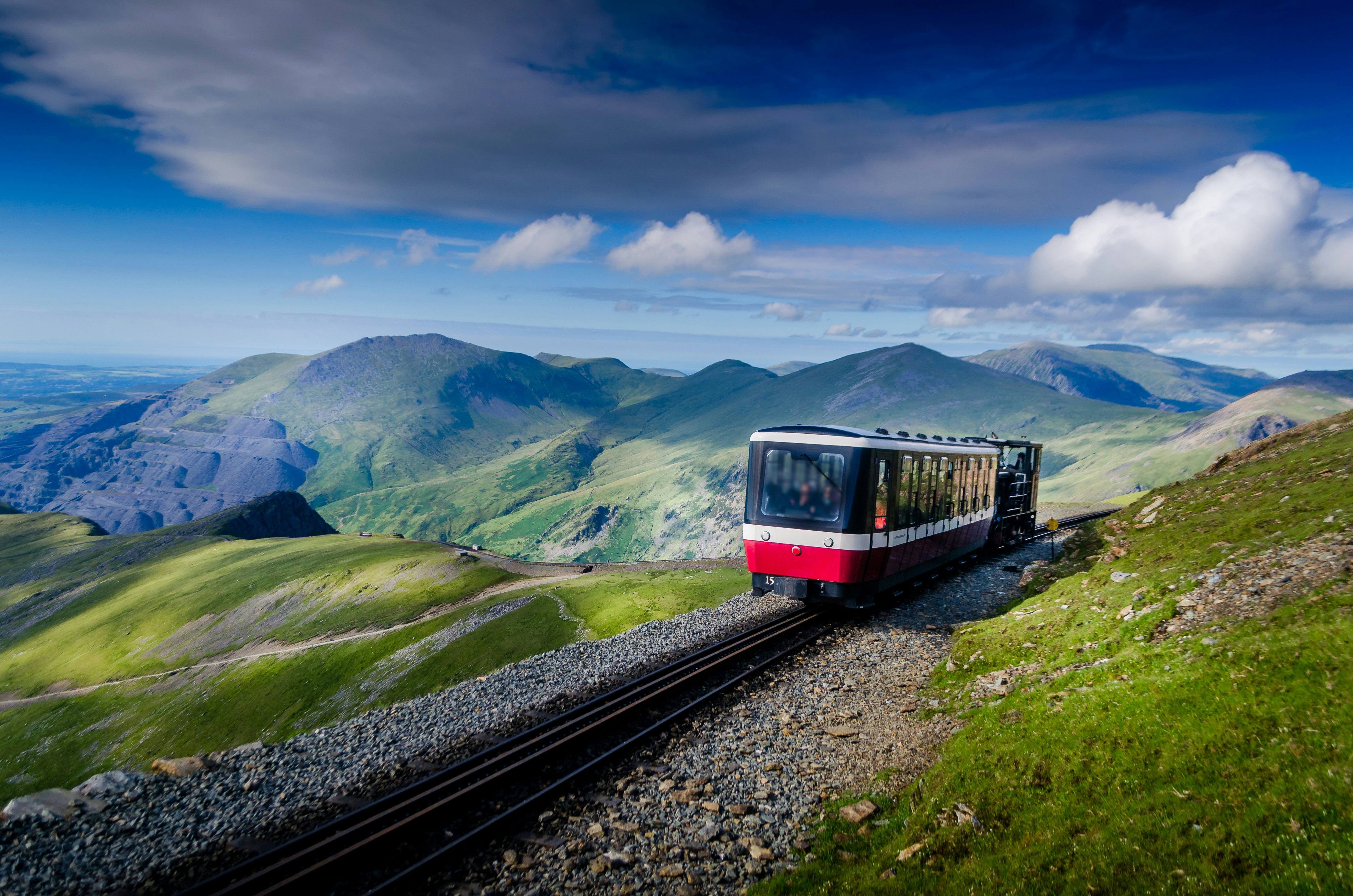 Train going up to the summit of mount Snowdon in Wales UK