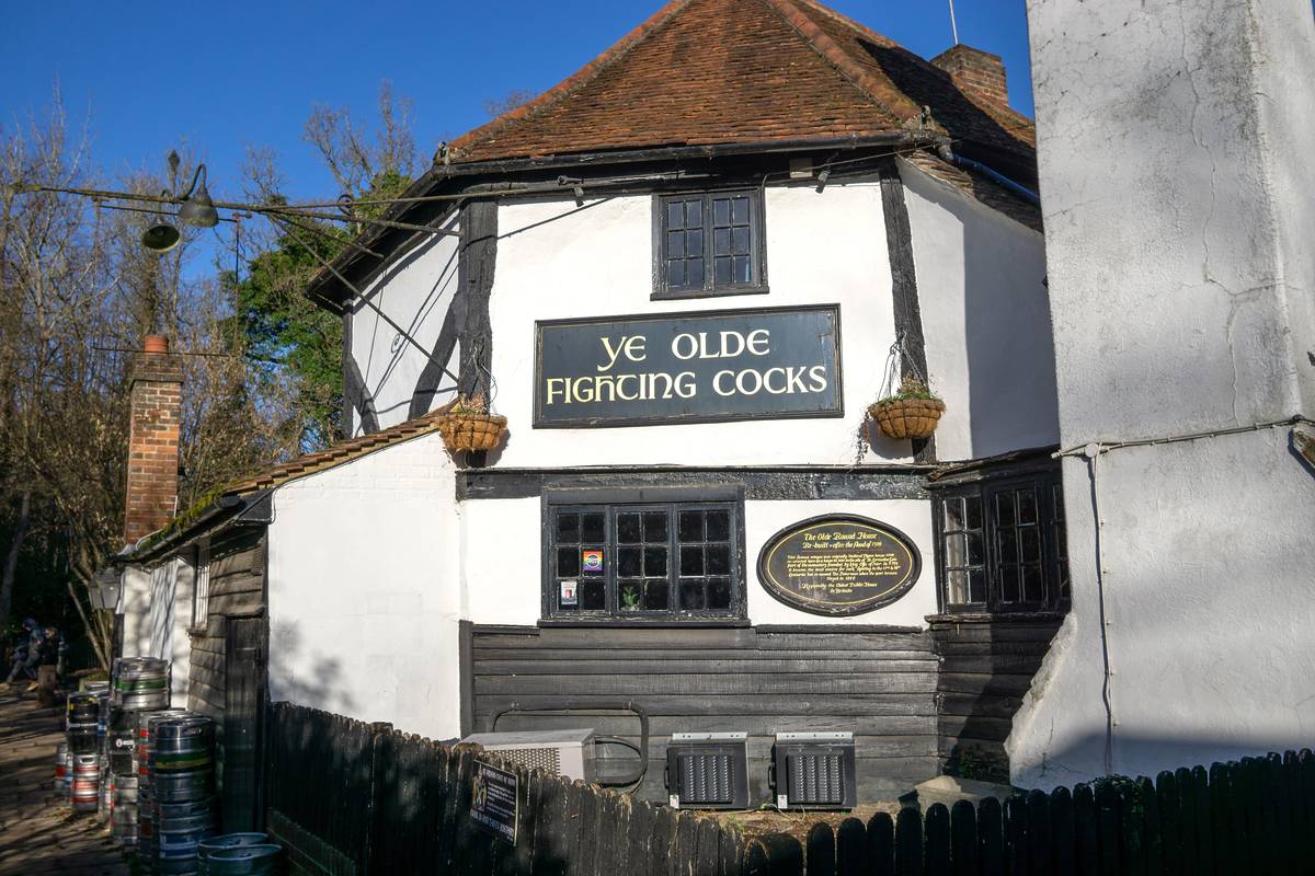 The white exterior of ye old fighting cocks pub in St Albans