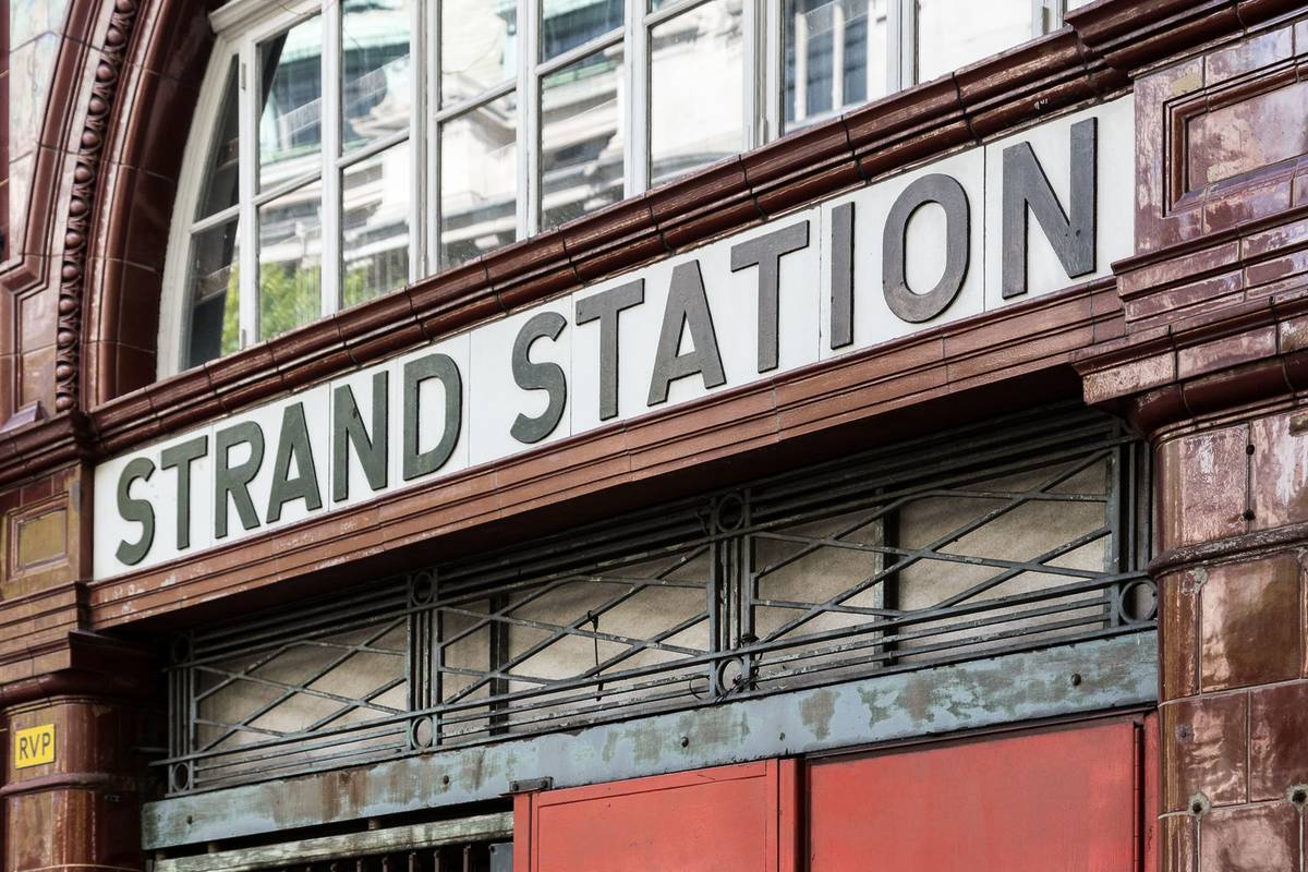 The Strand station sign above the entrance to the disused station