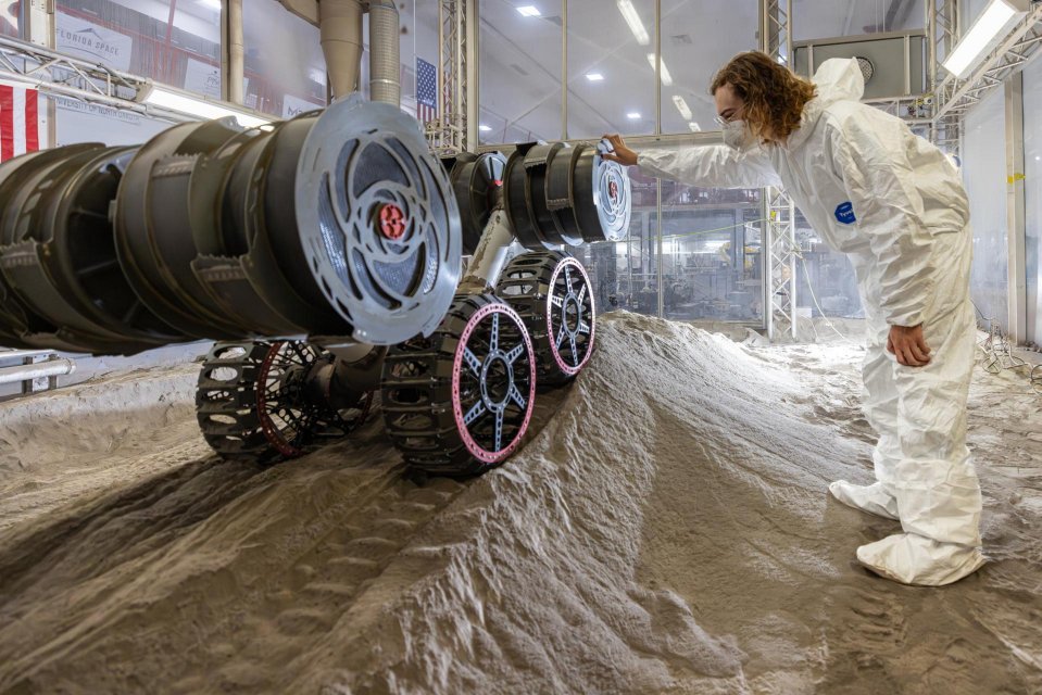 NASA's RASSOR robot excavating simulated lunar dust.