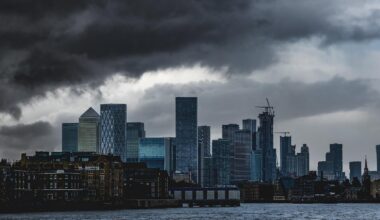 The City of London skyline seen under dark clouds