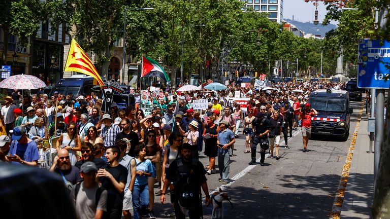 Demonstrators gather during a protest against mass tourism, in Barcelona, Spain. Pic: Reuters
