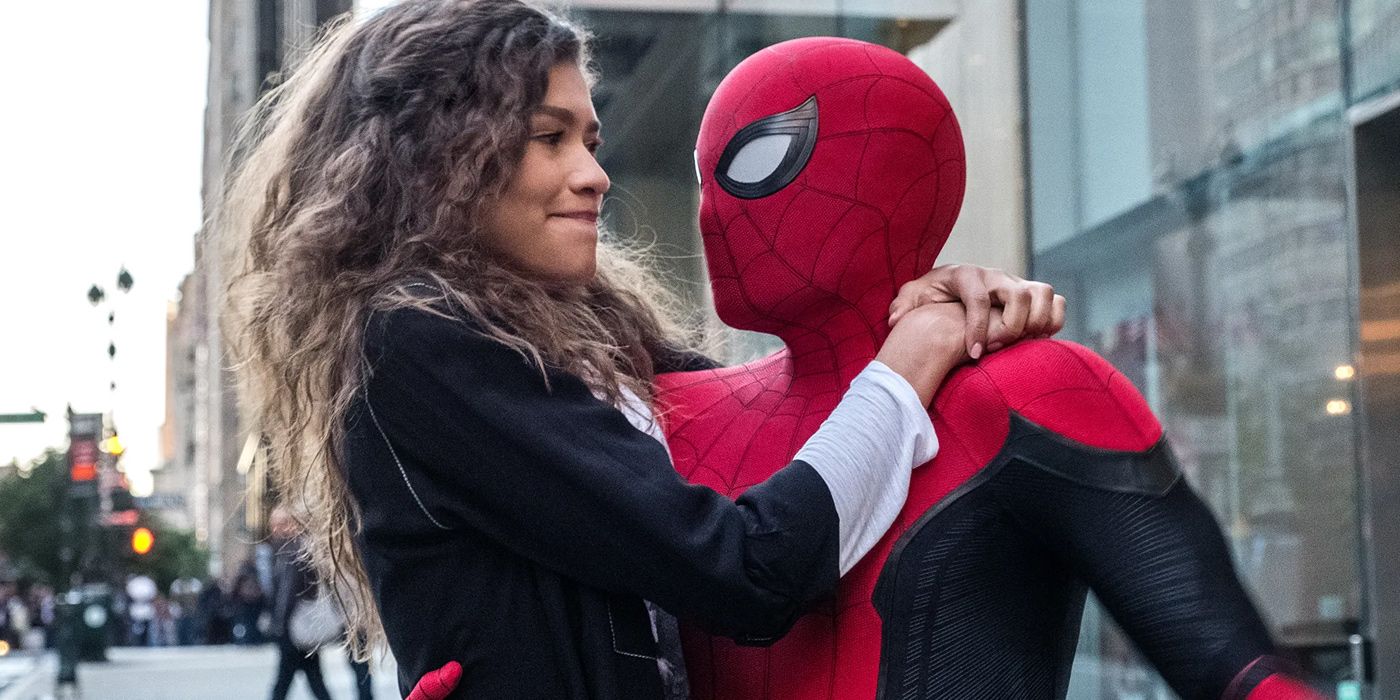 Spider-Man (Tom Holland) holds Mary Jane (Zendaya) after they land in Spider-Man Far From Home.