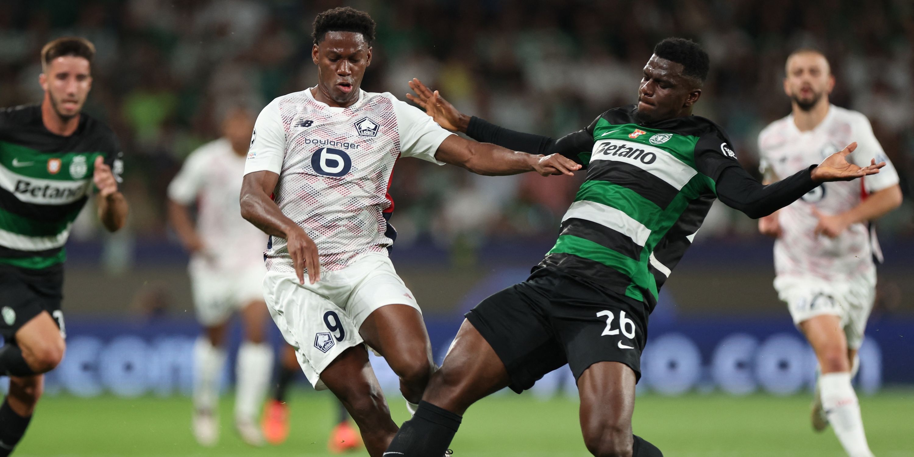 Sporting CP's Ousmane Diomande in action with Lille's Jonathan David