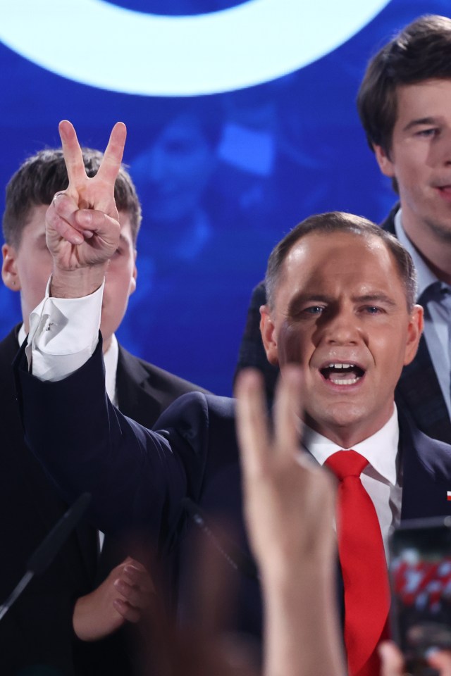 Karol Nawrocki, Law and Justice party candidate, giving a victory sign.