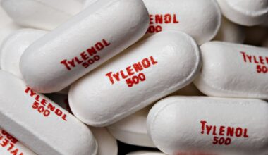 a close-up of white pills printed with the words &quot;Tylenol 500&quot;