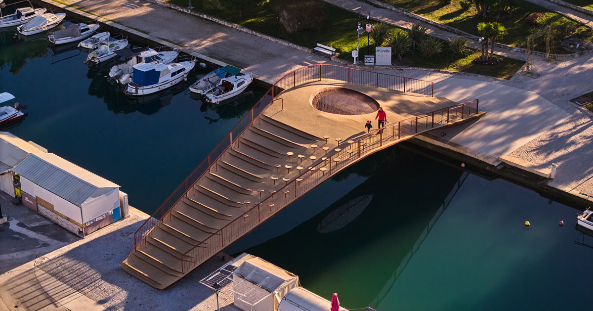 steel bridge with integrated net seating expands over port in croatia