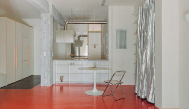 red floor runs over minimal 1970s athens apartment by threshold
