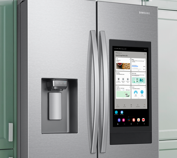\u200bSamsung' Family Hub Fridge Freezer pictured in a green kitchen with the tablet screen on