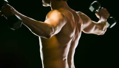 Caucasian man exercising with dumbbells
