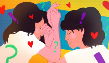A vibrantly coloured illustration of a couple in bed, holding hands and surrounded by illustrated hearts, question marks and exclamation marks.