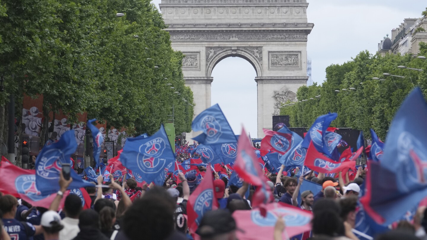 PSG holds victory parade in Paris with Champions League trophy after overnight violence