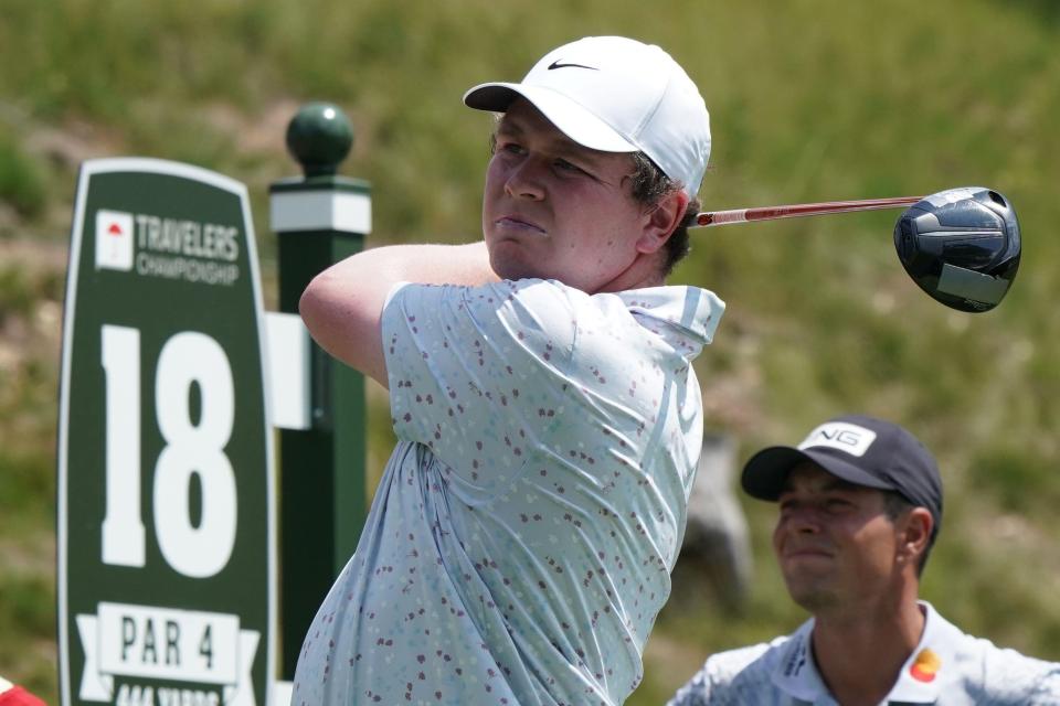 Robert MacIntyre watches his tee shot on the 18th hole at the Travelers Championship.