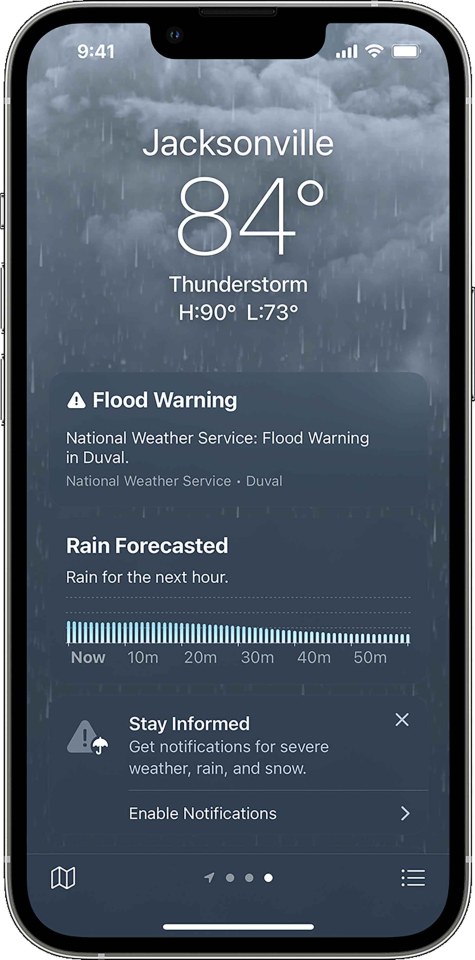 Smartphone screen showing a weather forecast for Jacksonville with a flood warning and hourly rain forecast.